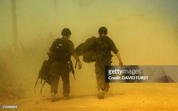 Israeli soldier walk out, away from the Lebanese border on their way to Israel after an incursion at an undisclosed location inside southern Lebanon,...