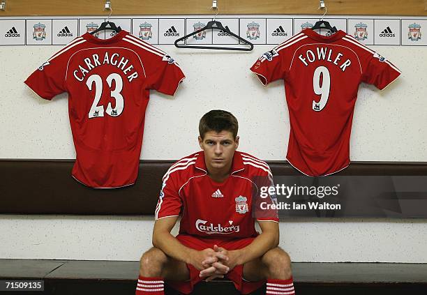 Liverpool captain Steven Gerrard shows off the new home kit in the dressing room during the Liverpool FC Adidas Kit Launch at Anfield on July 24,...
