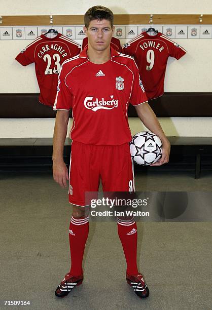 Liverpool captain Steven Gerrard shows off the new home kit in the dressing room during the Liverpool FC Adidas Kit Launch at Anfield on July 24,...