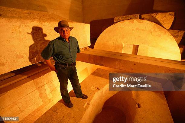 Doctor Zahi Hawass the secretary general of the Supreme Council of Antiquities poses in front of the empty sarcophagus of Infaa in August 2005 in...