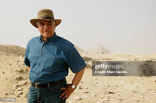 Doctor Zahi Hawass the secretary general of the Supreme Council of Antiquities poses in front of the pyramids of Giza in August 2005 in Giza, Egypt....