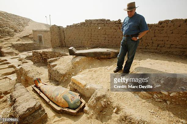 Doctor Zahi Hawass the secretary general of the Supreme Council of Antiquities poses next to the sarcophagus of a rich merchant in August 2005 in...