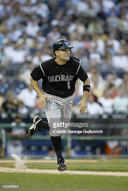 Second baseman Jamey Carroll of the Colorado Rockies runs to first base after batting against the Pittsburgh Pirates at PNC Park on July 18, 2006 in...