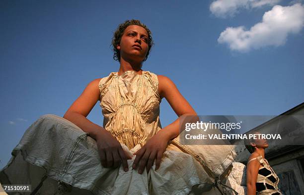 Models perform as they present creations by Bulgarian designer Mariela Gemisheva during an open air fashion show in Sofia, 24 July 2006. AFP PHOTO /...