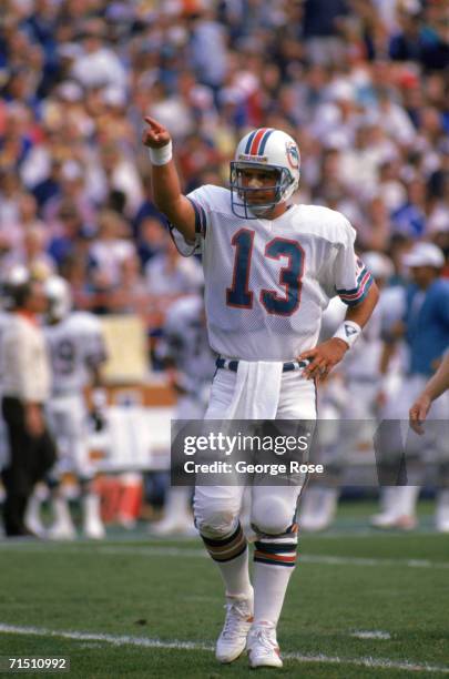 Quarterback Dan Marino of the Miami Dolphins points as he stand on the field during a game against the Los Angeles Rams at Anaheim Stadium on...