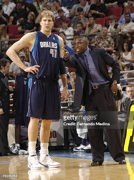 March 31: Dirk Nowitzki of the Dallas Mavericks gets instructions from head coach Avery Johnson against the Orlando Magic on March 31, 2006 at TD...