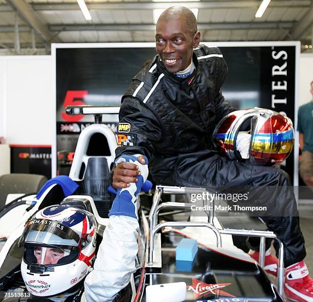 Nigel Mansell drives the Grand Prix Masters two-seater with passenger Maxi Jazz of Faithless during Grand Prix Masters Testing at Silverstone circuit...