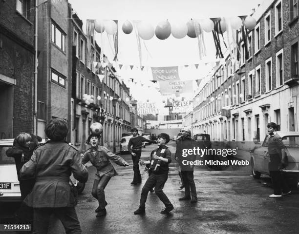 Group of boys celebrate the upcoming FA Cup Final between Leeds United and Chelsea at Wembley with a match of their own in Chelsea's Slaidburn...