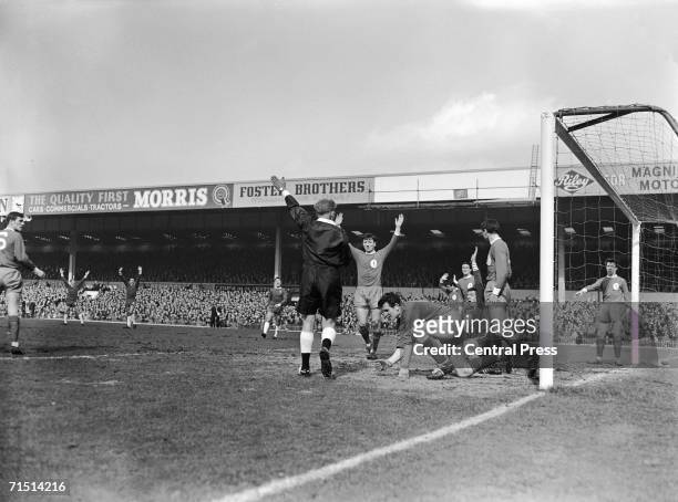 Referee D. W. Smith disallows a goal by Chelsea centre-half John Mortimer during the FA Cup semi-final against Liverpool at Birmingham's Villa Park...