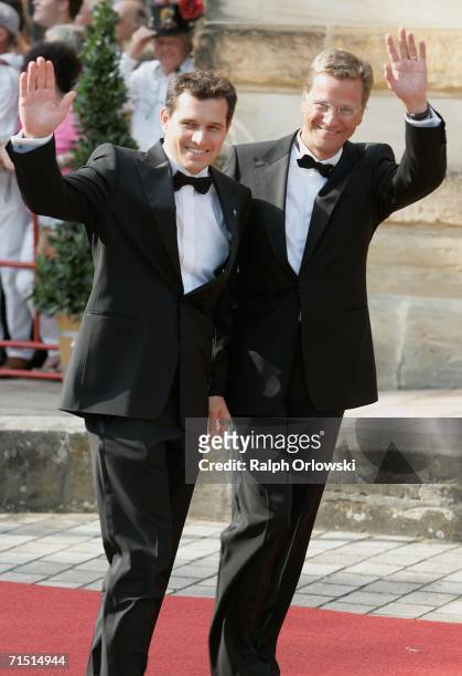 Leader of the German Liberal party Guido Westerwelle and his partner Michael Mronz arrive for the opening performance of Richard Wagner's "Der...