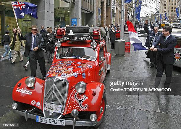 Former Australian deputy-prime minister Tim Fischer and French Consul General Laurent Delahousse flag off the first of 20 classic Citroen Traction...