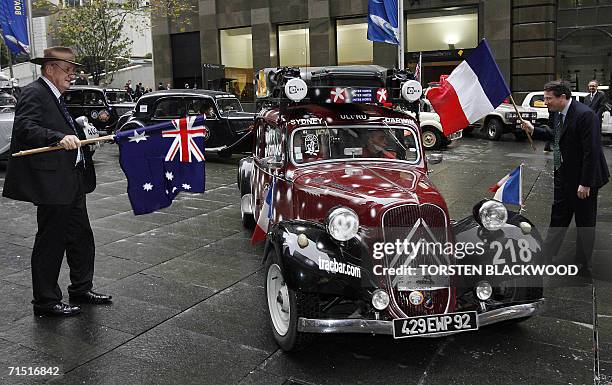Former Australian deputy-prime minister Tim Fischer and French Consul General Laurent Delahousse flag off 20 classic Citroen Traction Avant cars,...