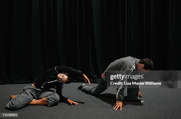 Lauren McFarlane and Michael Hemera stretch before competing in the 2006 FATD National Capital Dancesport Championships June 25, 2006 in Canberra,...