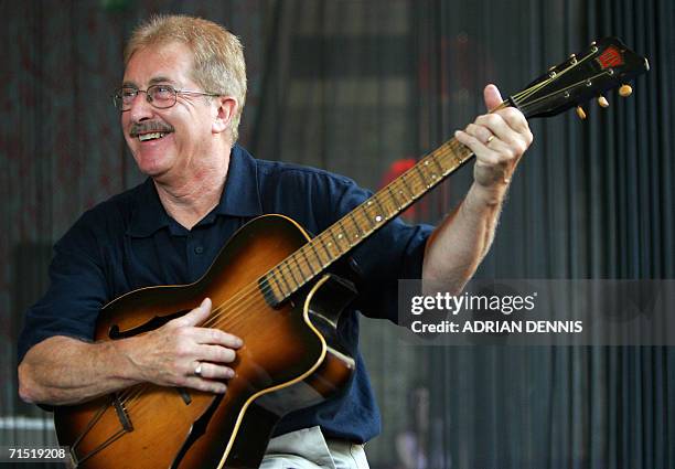 London, UNITED KINGDOM: The first guitar that Paul McCartney ever touched is played by longtime friend Ian James during a press preview in London 26...