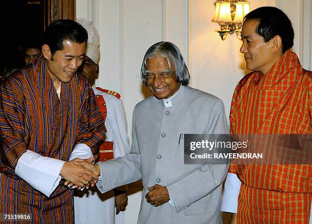 Indian President A.P.J. Abdul Kalam shakes hands with Bhutan's Crown Prince, Jigme Khesar Namgyal Wangchuck as the King of Bhutan, Jigme Singye...