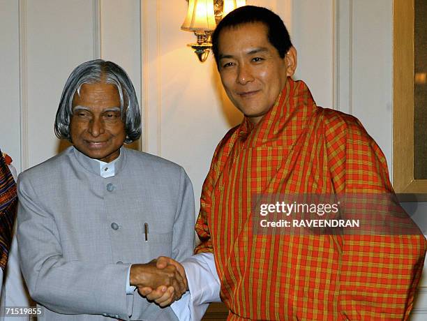 King of Bhutan, Jigme Singye Wangchuck shakes hands with Indian President, A.P.J. Abdul Kalam during a meeting at the Presidential Palace in New...