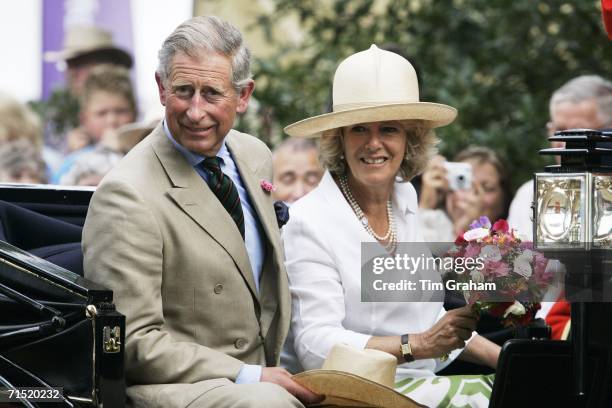 Prince Charles, Prince of Wales and Camilla, Duchess of Cornwall in an open carriage at the Sandringham Flower Show on July 26, 2006 in Norfolk,...