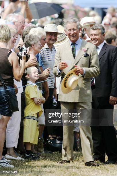 Prince Charles, Prince of Wales meets well-wishers during a visit to the Sandringham Flower Show on July 26, 2006 in Norfolk, England.