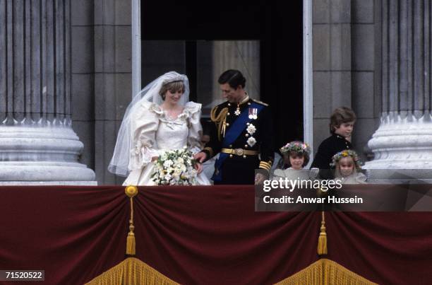 Prince Charles, Prince of Wales and Diana, Princess of Wales, wearing a wedding dress designed by David and Elizabeth Emanuel and the Spencer family...