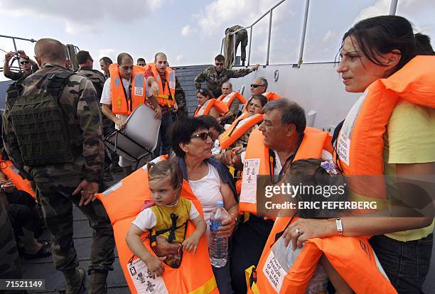 Frenchwoman Ghada Lenoir with her two daughters Elissa and 20-month-old Eliana, her mother Milia and father Elias Ajaka are evacuated by the French...