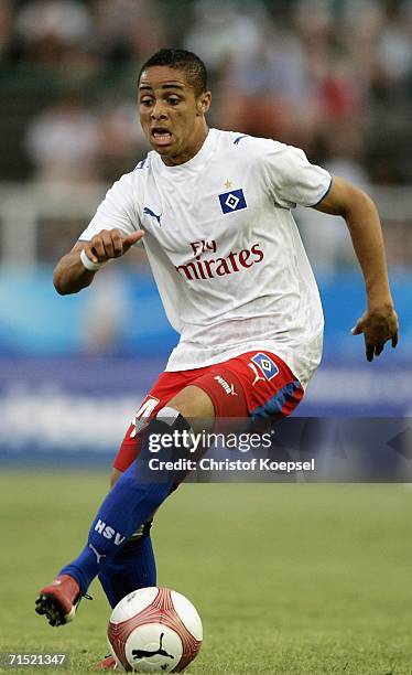 Sidney Sam of Hamburg runs with the ball during the friendly match between Preussen Munster and Hamburger SV at the Preussen Stadium on July 26, 2006...