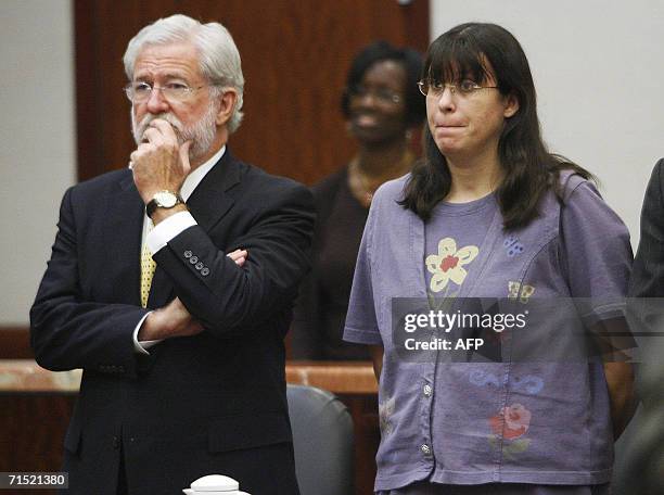 Houston, UNITED STATES: Andrea Yates stands with her attorney George Parnham as the not guilty by reason of insanity verdict is read in her retrial...