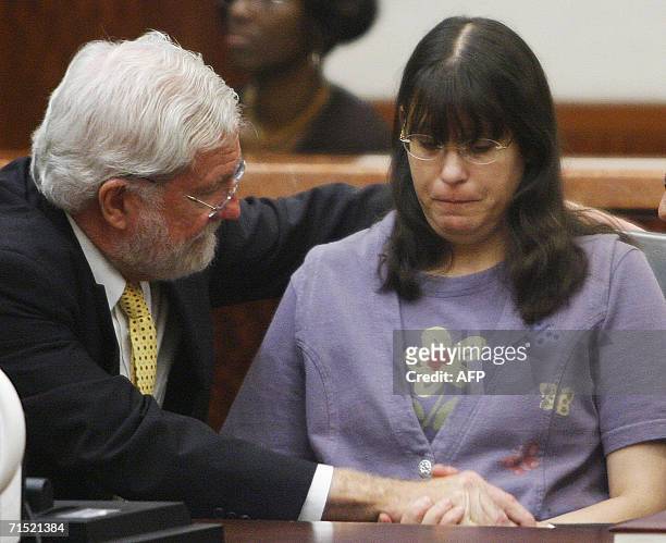 Houston, UNITED STATES: Andrea Yates sits with her attorney George Parnham after the not guilty by reason of insanity verdict was read in her retrial...