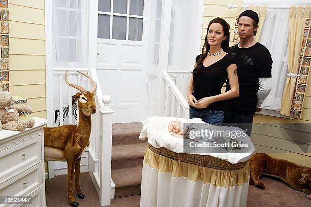 The Shiloh Nouvel Jolie Pitt wax figure debuts at Madame Tussauds with her parents wax figures, Angelina Jolie and Brad Pitt, on July 26, 2006 in New...