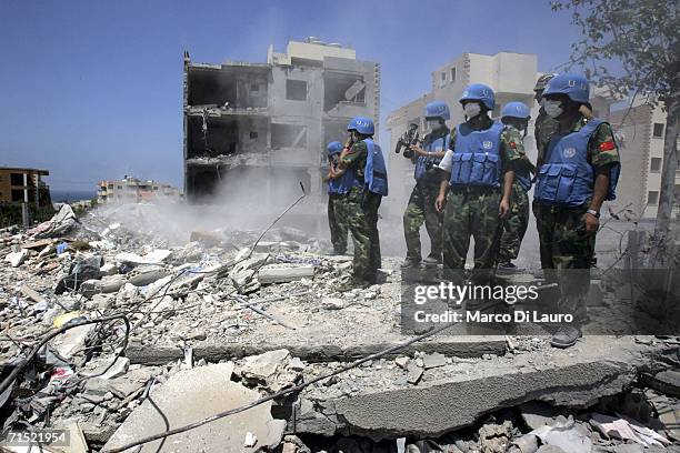 United Nation Interim Force in Lebanon rescue teams excavate a bomb site during a UN mission to recover bodies from the site where a UNIFIL solider...