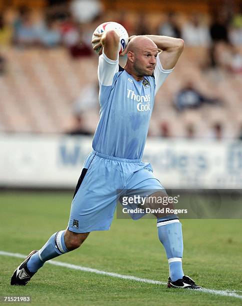 Danny Mills of Manchester City takes a throw in during the pre-season friendly match between Port Vale and Manchester City at Vale Park on July 26,...