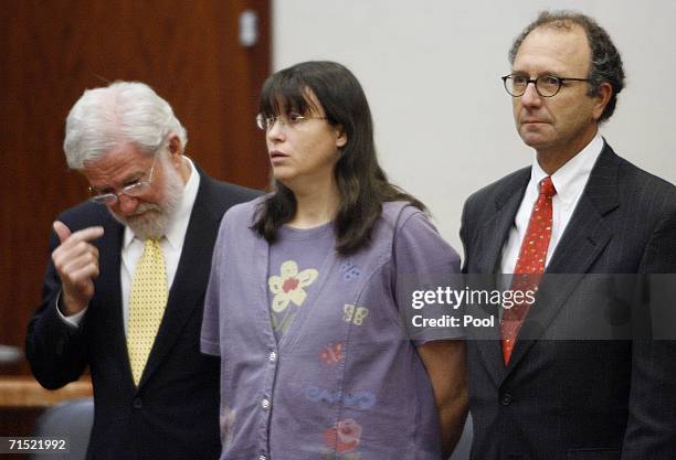 Andrea Yates listens with her attorneys, George Parnham and Wendell Odom to the not guilty by reason of insanity verdict in her retrial July 26, 2006...