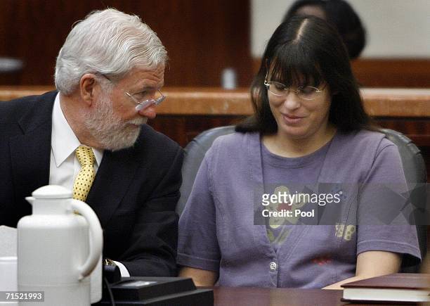 Andrea Yates smiles with her attorney George Parnham as they await the verdict in her retrial July 26, 2006 in Houston. Yates admits to drowning her...