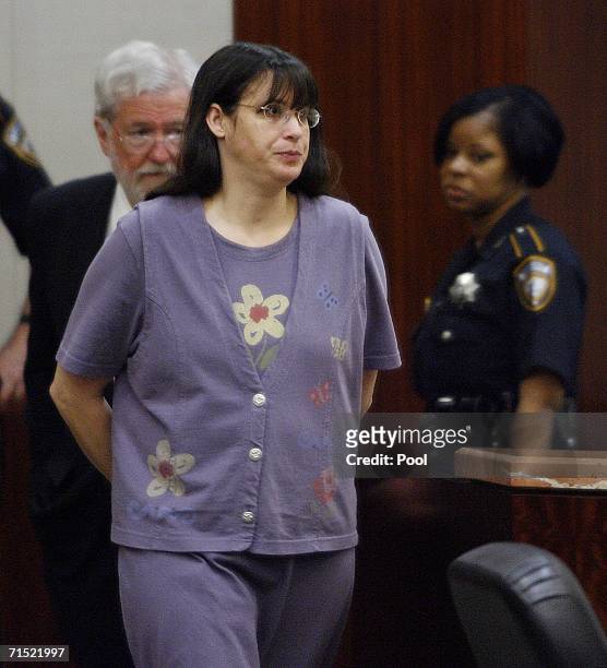 Andrea Yates enters the courtroom followed by her attorney George Parnham to hear the verdict in her retrial July 26, 2006 in Houston. Yates admits...