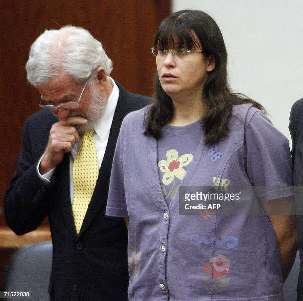 Houston, UNITED STATES: Andrea Yates and her attorney George Parnham listen as the verdict is read in her murder retrial 26 July in Houston, Texas....