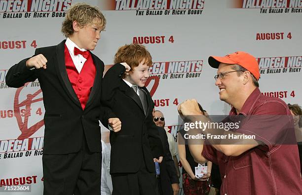 Director Adam McKay jokes with actors Houston Tumlin and Grayson Russell during arrivals for the premiere of "Talladega Nights: The Ballad of Ricky...