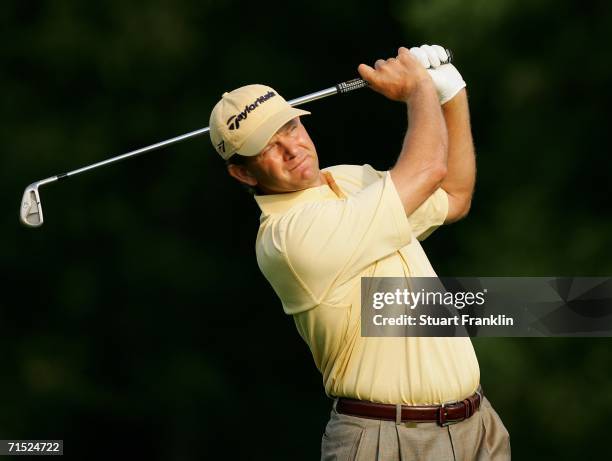 Retief Goosen of South Africa plays his approach shot on the 11th hole during the first round of The Deutsche Bank Players Championship of Europe at...