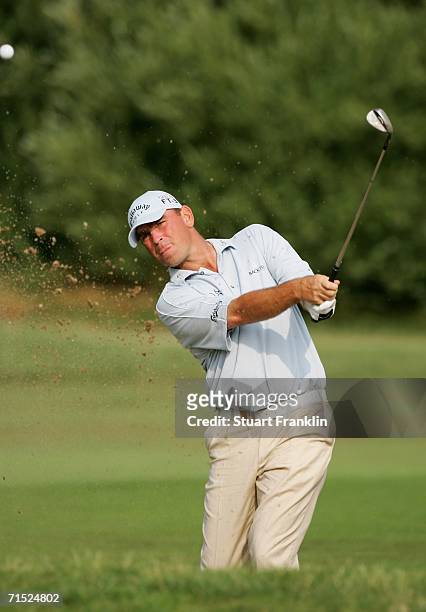 Thomas Bjorn of Denmark plays his bunker on the 13th hole during the first round of The Deutsche Bank Players Championship of Europe at Gut Kaden...