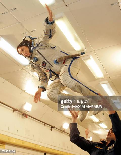 Entrepreneur Anousheh Ansari , due to become the first female space tourist, enjoys "flying" in a zero-gravity simulator, a Russian IL-76 MDK...