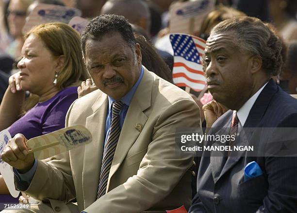 Washington, UNITED STATES: Civil rights activists Jesse Jackson and Al Sharpton wait for the signing ceremony of H.R. 9, the Fannie Lou Hamer, Rosa...