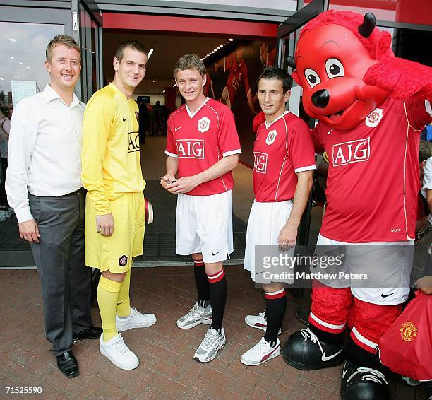 Tom Heaton, Ole Gunnar Solskjaer and Liam Miller of Manchester United officially open the new Manchester United Megastore at the Official launch of...