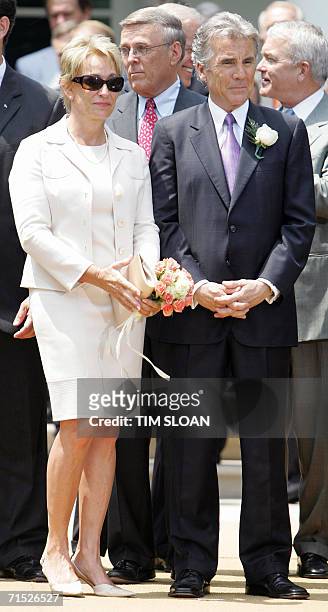 Washington, UNITED STATES: John Walsh and his wife Reve wait for the arrival of US President George W. Bush to sign H.R. 4472, the Adam Walsh Child...