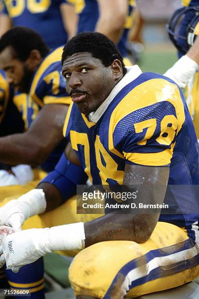 Offensive tackle Jackie Slater of the Los Angeles Rams sits on the bench during a circa 1980s game at Anaheim Stadium in Anaheim, California. Slater...