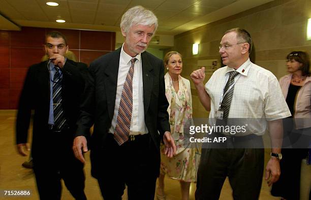 Finnish Foreign Minister Erkki Tuomioja walks with EU commissioner Benitta Ferrero Waldner during a visit in Rambam hospital at the northern city of...