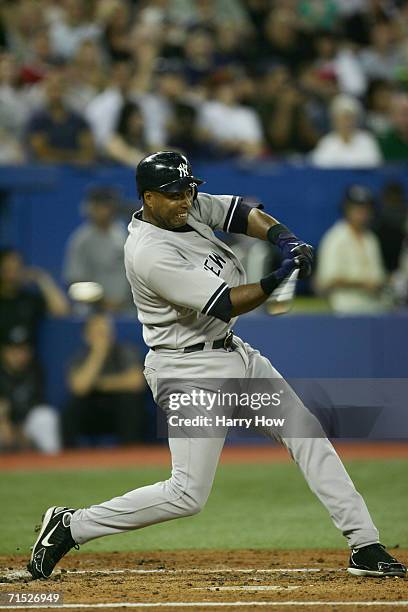 Outfielder Bernie Williams of the New York Yankees swings at Toronto Blue Jays pitch during the game on July 22, 2006 at the Rogers Centre in...