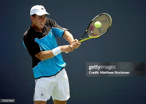 Dominik Hrbaty of Slovakia sends a backhand to Lars Burgsmuller of Germany during the Countrywide Classic on July 27, 2006 in Straus Stadium at the...