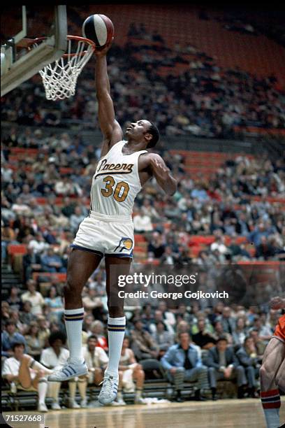 Forward George McGinnis of the American Basketball Association Indiana Pacers in action at Market Square Arena on February 8, 1975 in Indianapolis,...