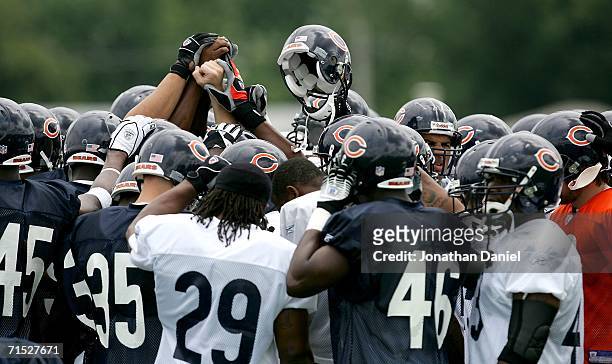 Members of the Chicago Bears prepare for the first summer training camp practice on July 27, 2006 at Olivet Nazarene University in Bourbonnais,...