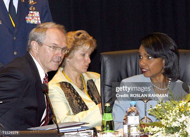 Kuala Lumpur, MALAYSIA: US Secretary of State Condoleezza Rice talks to US chief negotiator on North Korea, Christopher Hill , during multilateral...