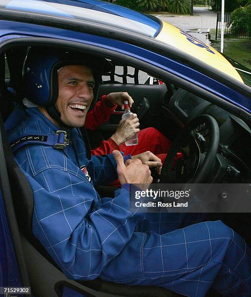 Doug Howlett of the All Blacks gets behind the wheel of a V8 Supercar during a visit to the Performance Driving Centre of the Gold Coast on July 26,...