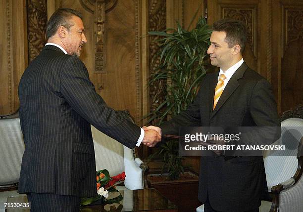 Macedonian President Branko Crvenkovski hands the government mandate to Nikola Gruevski the leader of the VMRO-DPMNE party in Macedonia's capital...